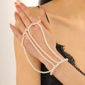 Detailed view of multilayer pearl slave bracelet with rings and connecting chain strands - White Multi-layer Style (8928)
