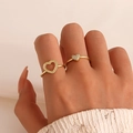Close-up of golden heart ring set with zircons on hand with white knit sleeve - Hollow Heart Style (12254) / Two-Piece Set / Light KC Gold