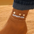 Bohemian gold plated anklet set with faux pearls and metal discs on a sandy beach - Gold Triple Layer Pearl Round Plate (7505)