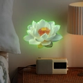 Luminous white lotus wall sticker with glowing green edges in a cozy bedroom setting - Green Glow (fun-yg034)