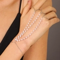 Elegant silver chain finger bracelet with three rows of pink pearls and ring connectors - Silver Style (1816)