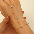 Elegant gold chain hand harness bracelet with sparkling cubic zirconia flower accents - Triple Cluster Rhinestone Ring-Linked Bracelet / Gold Style (A-564)