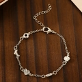 Silver multi-element charm bracelet with heart and seashell pendants on wooden surface - Multi-pendant Style (DZ-504) / Bright Silver