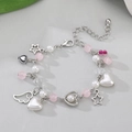 Elegante pulsera de perlas hecha a mano con cuentas rosas y dijes de corazón y ala plata - Pulsera de Cuentas Plateada con Colgantes de Alas Estrellas Rosa Blanco (2155)