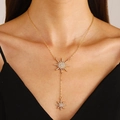 Elegant gold Y-shaped necklace with sparkling rhinestone star pendants on a model - Gold (4712)
