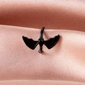 Gothic style matte black bat ear cuff jewelry displayed on soft pink satin fabric - Bat Ear Cuff (04 Matte Black 7802) / Matte Black