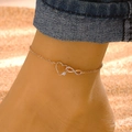 Macro shot of rose gold infinity and heart anklet with sparkling pavé cubic zirconia - KC Gold Heart Infinity Style (K-1022)