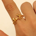Detailed view of gold branch ring with bird design worn on finger for texture - Twin Birds and Branches Style (7587)