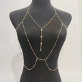 Detailed view of layered gold body chain featuring delicate beads and tassels on a mannequin - Gold (6333)