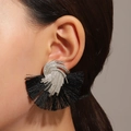 Retro fan-shaped silver earrings with black tassels shown on a model's ear - Black