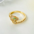Detail of gold snake ring with micro-paved white zircons and emerald green stone eye - KC Gold