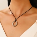 Close-up of minimalist black wax cord necklace with a polished silver oval metal pendant - Oval Pendant Style (Silver)