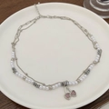 Double-layered cherry necklace set with pink heart charms and pearls on white ceramic - Heart Cherry Artificial Pearl Layered Necklace (0120) / Silver
