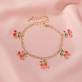 Delicate gold bracelet with five red cherry pendants and green leaves on silk - Cherry Bracelet (6848) / 5 Cherry Pendants / KC Gold