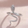 Micro-pave zircon silver snake ring with black gem eyes and sleek wavy metal band - White Gold