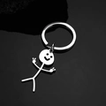 Portachiavi divertente stickman in acciaio inossidabile con doppio segno di vittoria e sorriso - Portachiavi Omino Smiley / Argento