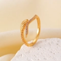 Elegant gold snake ring with micro-pave zircons and textured scales on a silk background - KC Gold