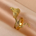 Elegant gold-plated snake wrap ring with detailed scale engraving on luxury champagne silk - Antique Gold