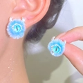 Close-up of sky blue plush monster eyeball ring with silver horns and soft fur details - Monster Eyeball Style / 11 Bright Silver Blue (N-526)