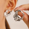 Detailed close-up of silver earrings with irregular lava texture and molten metal style - Silver Liquid Lava Irregular Style (1255)