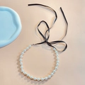 Detail of white pearl necklace with black velvet ribbon and adjustable metal clasp closure - Black Style 1 (01 Black 2522)
