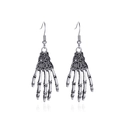 Vintage silver skeleton hand earrings in antique style with hooks on white background - Skeleton Hand