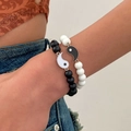 Close-up of Yin Yang charm bracelets with matte black and white stone beads for couples - Black and White Tai Chi Beaded Couple Bracelet Style (0012)