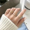 22-piece gold knuckle ring set with delicate twists and faux pearl accents on hand - 5-Piece Set (DZ-365) / Five-Piece Set / KC Gold