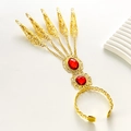 Exotic golden fingernail bracelet with red gemstones and filigree hollow claw design - Red