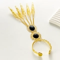 Ethnic golden hand harness with five finger nail rings and black gemstone accents - Black