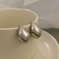 French style hollow silver drop earrings in high-polished finish on ceramic cup - Thick Silver Water Drop Minimalist (M-773)