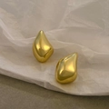 Polished gold teardrop hollow earrings on artistic wrinkled paper background - 14K Imitation Gold Irregular Teardrop (M-776)