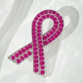 Elegant ribbon brooch with vibrant pink rhinestones on a polished silver metal base - Purple Rhinestone Ribbon