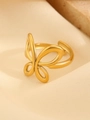 Close-up of golden stainless steel butterfly ring on a silk background with adjustable band - Gold Hollow Butterfly Open Ring (N-207)