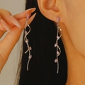 Silver flower tassel drop earrings with pink crystals on model for elegant look - Pink Rhinestone Spiral Tassel (1953)