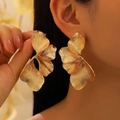 Close-up of oversized golden petal earrings with textured brushed alloy finish - Large Profile Brushed Petal (KC Gold) / Gold
