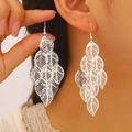 Macro detail of silver-tone layered leaf earrings with delicate hollow vein textures - Hollow Multi-layer Leaf (8595) / Gold