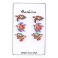 Three pairs of colorful turtle wooden stud earrings set on a white display card - Colorful Sea Turtle Set