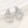 Elegant silver conch shell stud earrings with spiral texture on a white wavy pedestal - Silver Conch Stud Earrings (N-204)