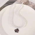 Gothic retro pearl necklace with a black cat pendant featuring pink heart rhinestones - Cat
