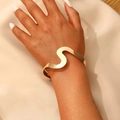 Polished gold S-shaped irregular open cuff bracelet for women featuring minimalist curves - Golden S-Curve Open Bracelet (27)
