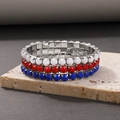 Detailed macro view of three elastic beaded bracelets with red, white and blue faceted beads - Prong Setting Elastic Bracelet (12274) / Three-Piece Set / Red White Blue Mixed