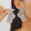 Silver ginkgo leaf earrings with radial texture shown on model in a punk style - Layered Ginkgo Leaf Pleated Style (White K A-109) / Silver