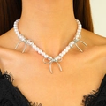 Close-up of elegant double-layer pearl necklace with silver bow charms on model - Triple Bow Pearl Necklace (N-097) / Silver/White