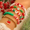 Dettaglio del set di cinque braccialetti natalizi in argilla con ciondoli di Babbo Natale - Campana 5 Pezzi (07)