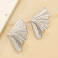 Macro detail of silver ginkgo leaf earrings with fine textured radial veins on fabric - Brushed Texture Ginkgo Leaf Earrings (DZ-317) / Steel