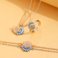 Elegante zon en maan sieradenset in goud en zilver met fonkelende blauwe steentjes - Driedelige Set (1311+7103+X108)