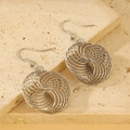 Silver geometric spiral swirl hollow round earrings with sleek metallic finish - Bird's Nest Mesh Style (1994)