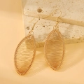 Golden drop-shaped earrings with wire-wrapped geometric mesh design on stone base - Oval Woven Style (8348)