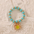 Handmade beaded ring with light blue beads and a golden crab pendant accessory - Crab Style (DZ-905)